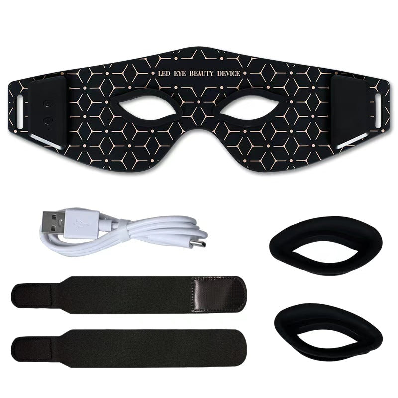 LED eye beauty device with USB cable and straps on a white background