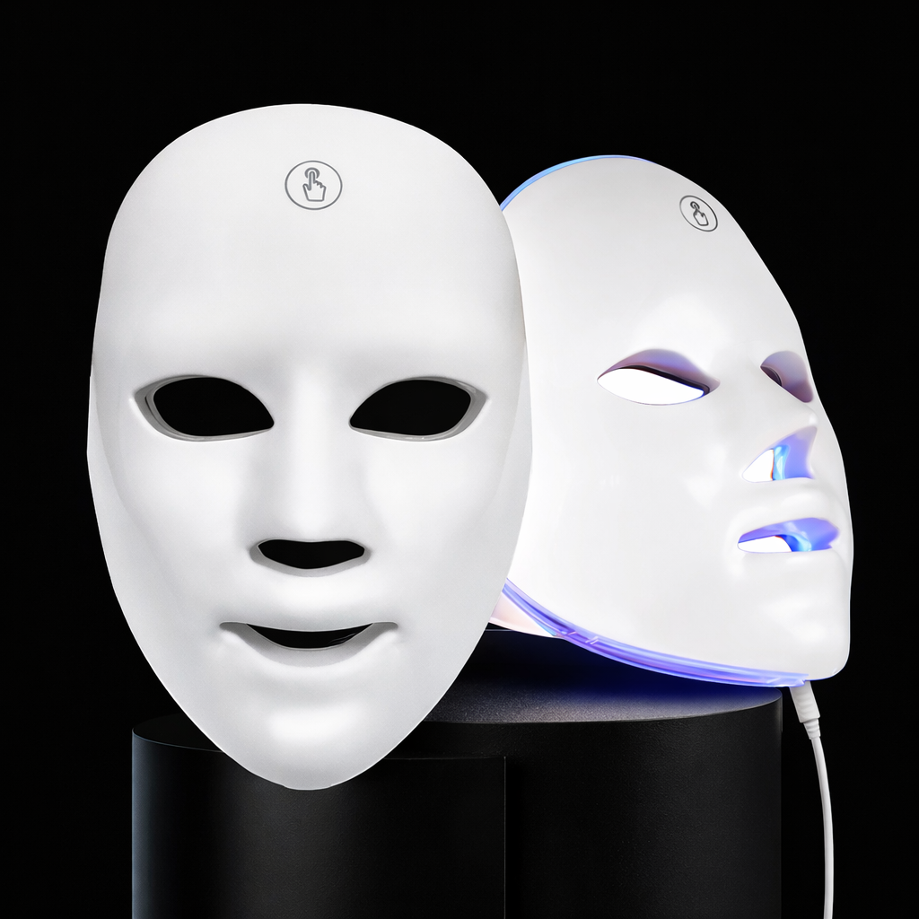 Two LED face masks on black stands with one glowing blue.