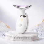 White electronic device on a marble base with a light gray background